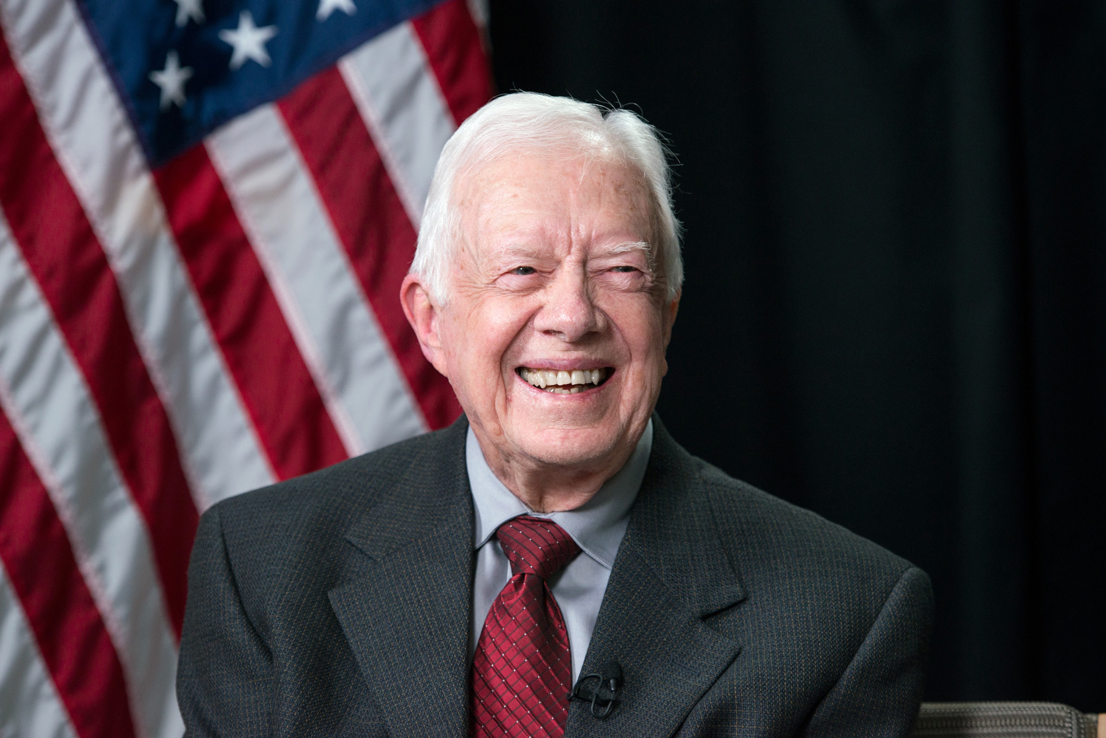 Image of former president Jimmy Carter in front of american flag